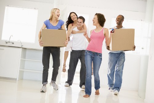 Team member handling moving equipment safely during a van job