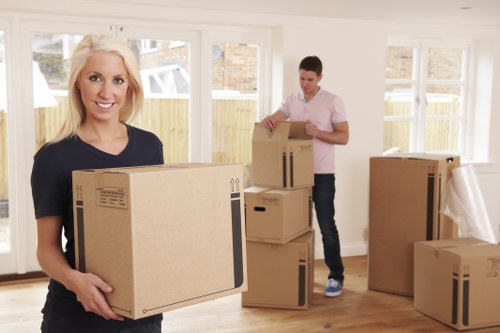Local removals team handling furniture in a Bermondsey apartment building