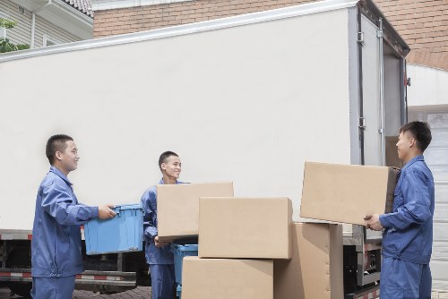 Packed moving boxes and household items ready for removal in a Bermondsey property