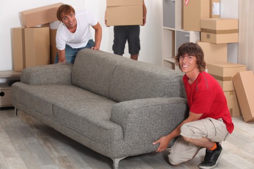 Customer and mover reviewing booking details for a van service
